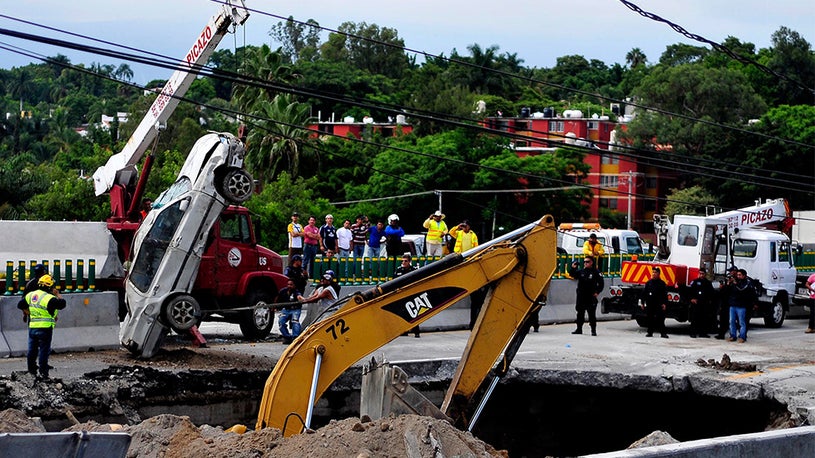 Father Son Killed After Driving Into Highway Sinkhole In