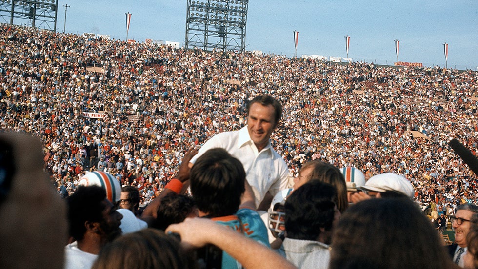 LOS ANGELES, CA - JANUARY 14:  Head Coach Don Shula of the Miami Dolphins gets carried off the field after defeating the Washington Redskins in Super Bowl VII at the Los Angeles Memorial Coliseum in Los Angeles, California, January 14, 1973. The Dolphins won the Super Bowl 14-7. (Photo by Focus on Sport/Getty Images) 