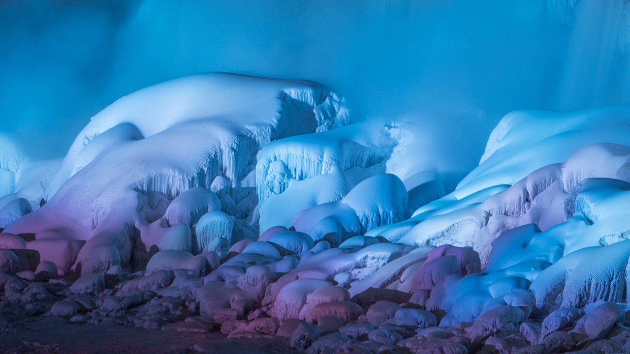 Photographer Adam Klekotka stood in freezing temperatures to capture a stunning view of Niagara Falls, frozen and illuminated by colorful lights. (Adam Klekotka)
