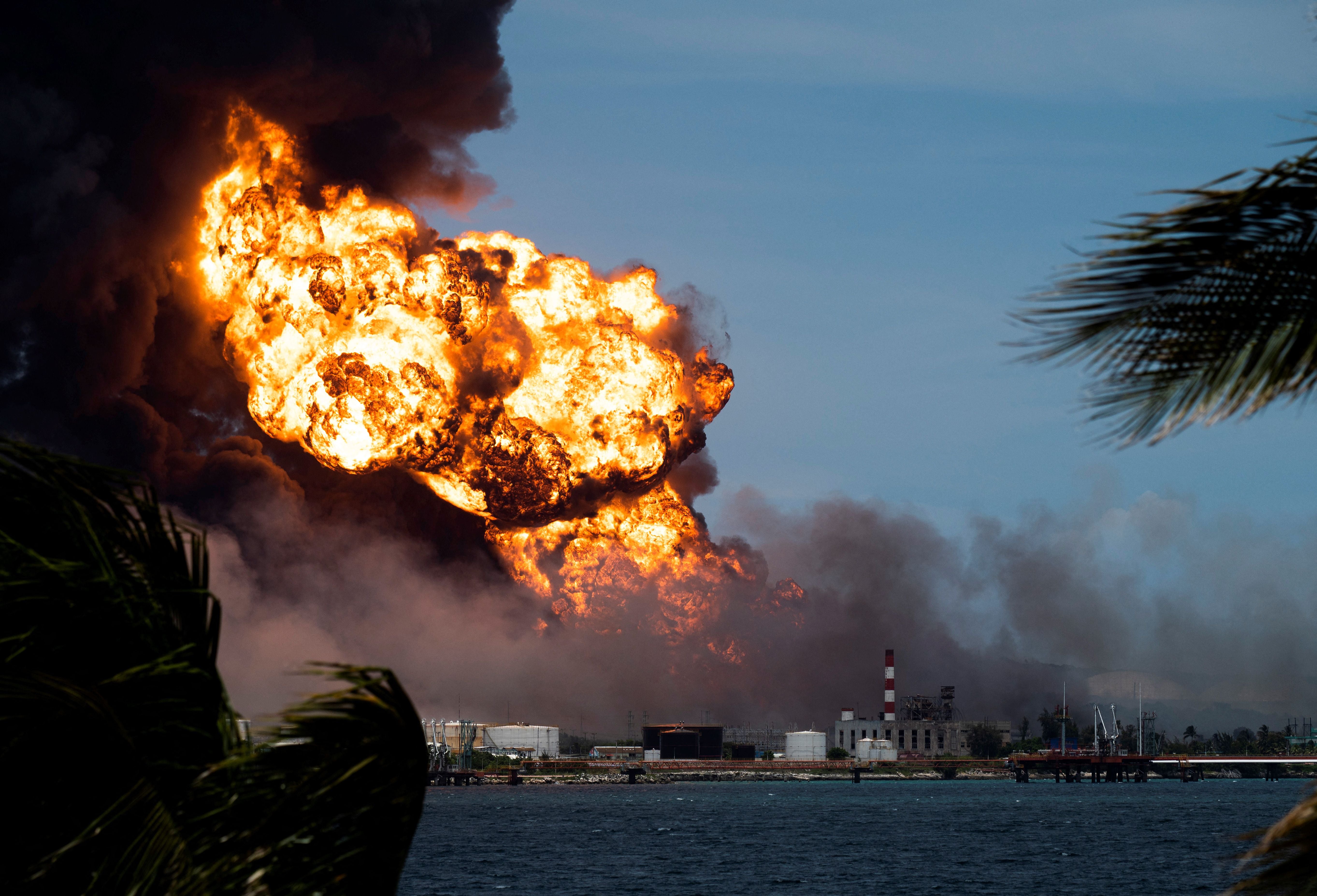 Flames rise from a massive fire at a fuel depot sparked by a lightning strike in Matanzas, Cuba, on Aug. 8, 2022. (Yamil Lage/AFP via Getty Images)