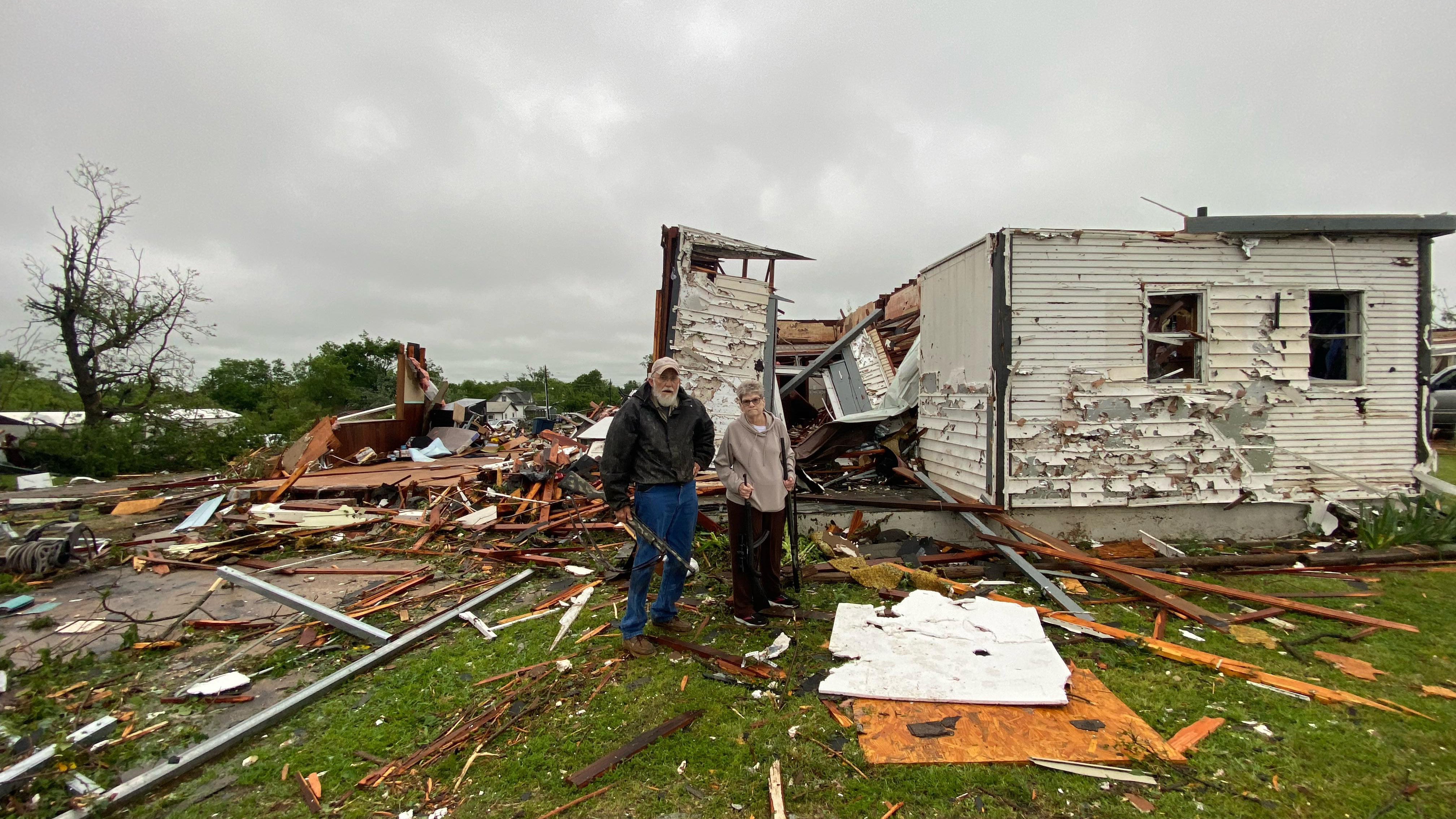 Jo and Larry Palmer stand in front of their destroyed home in Sulphur, Oklahoma. (Payton McClure)