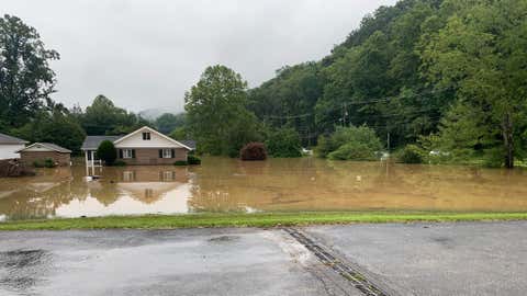 Floodwaters surround a home on Greenbrier Street in Charleston, W.V., on Monday, Aug. 15, 2022. (Brad White)