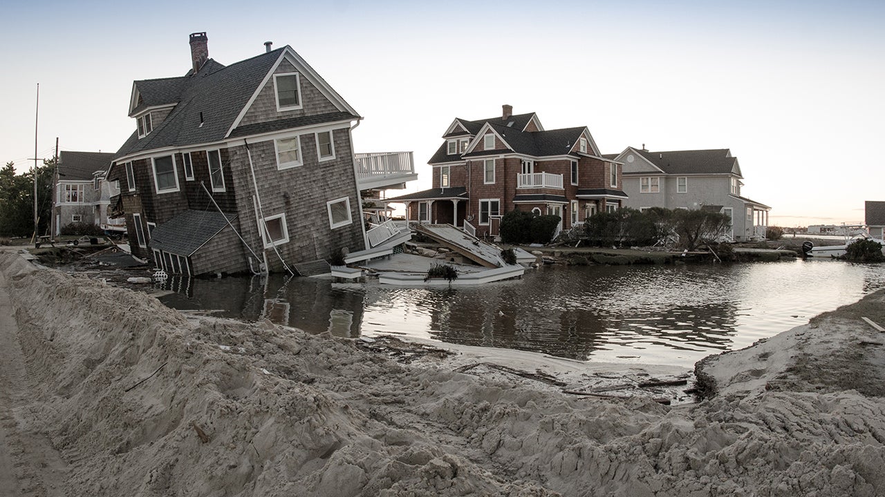 A home in Mantoloking, N.J., is seen damaged and surrounded by floodwaters in Nov. 2012. (Liz Roll/weather.com)