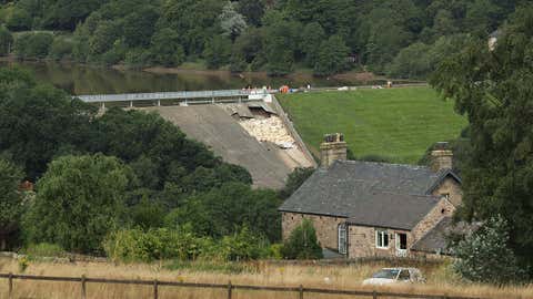 A view of the damaged Toddbrook Reservoir near the village of Whaley Bridge in Derbyshire, England, Saturday August 3, 2019. (Yui Mok/PA via AP)