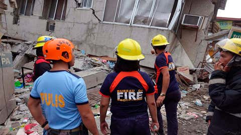 Residents and rescuers check damaged structures after an earthquake that struck Padada, Davao del Sur province, in the southern Philippines on Sunday, December 15, 2019. (AP Photo)