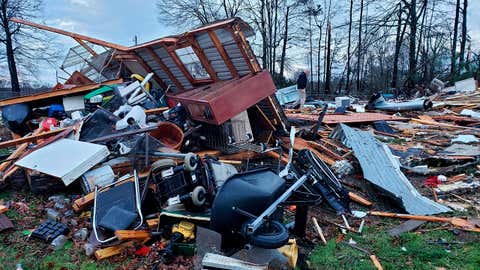 This photo provided by Bossier Parish Sheriff's Office shows damage from Friday nights severe weather, including the home of an elderly in Bossier Parish, La., on Saturday, Jan. 11, 2020.  The Bossier Parish Sheriff's Office said that the bodies of an elderly couple were found Saturday near their demolished trailer by firefighters. A search for more possible victims was underway.  (Lt. Bill Davis/Bossier Parish Sheriff's Office via AP)