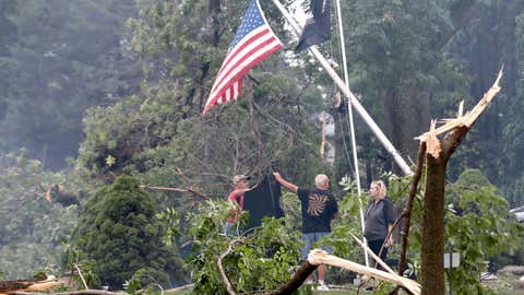 Jefferson County residents inspect damage at Dahnert Park, Thursday, July 29, 2021 in Concord, Wis., following an overnight storm. (John Hart/Wisconsin State Journal via AP)