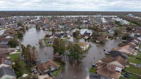 Flooded streets and homes are shown in the Spring Meadow subdivision in LaPlace, La., after Hurricane Ida moved through Monday, Aug. 30, 2021. Hard-hit LaPlace is squeezed between the Mississippi River and Lake Pontchartrain. (AP Photo/Steve Helber)