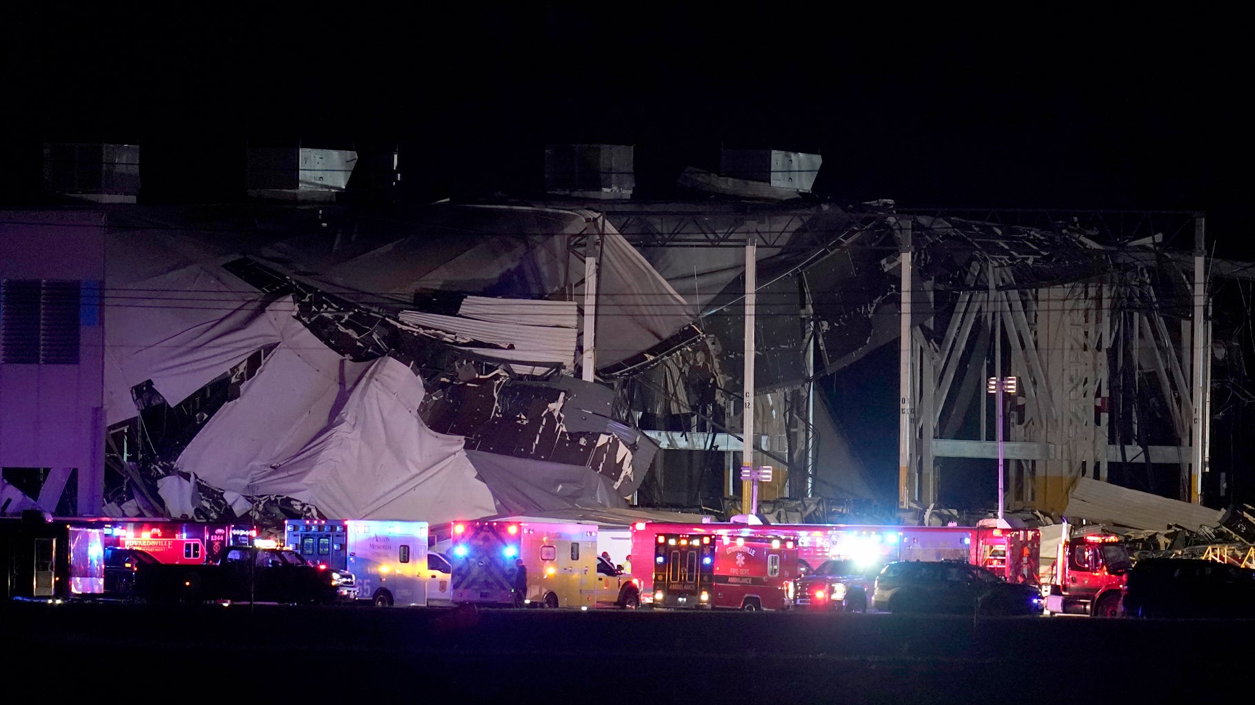 An Amazon distribution center is heavily damaged after a severe storm moved through the area Friday, Dec. 10, 2021, in Edwardsville, Illinois. (AP Photo/Jeff Roberson)