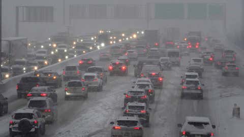 Motorists navigate the northbound, left, and southbound lanes of Interstate 90-40 during a snowy morning, Wednesday, Feb. 2, 2022, Chicago. (AP Photo/Charles Rex Arbogast)