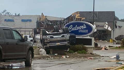 This image provided by Steven Bischer, shows an upended vehicle following an apparent tornado, Friday, May 20, 2022, in Gaylord, Mich. (Steven Bischer via AP)