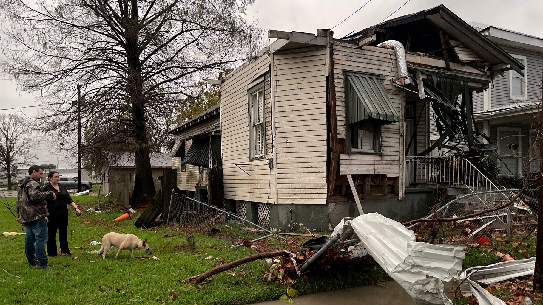A house is seen damaged after a confirmed tornado on Friscoville Avenue in Arabi, Louisiana, in St. Bernard Parish, Wednesday, Dec. 14, 2022. (AP Photo/Matthew Hinton)