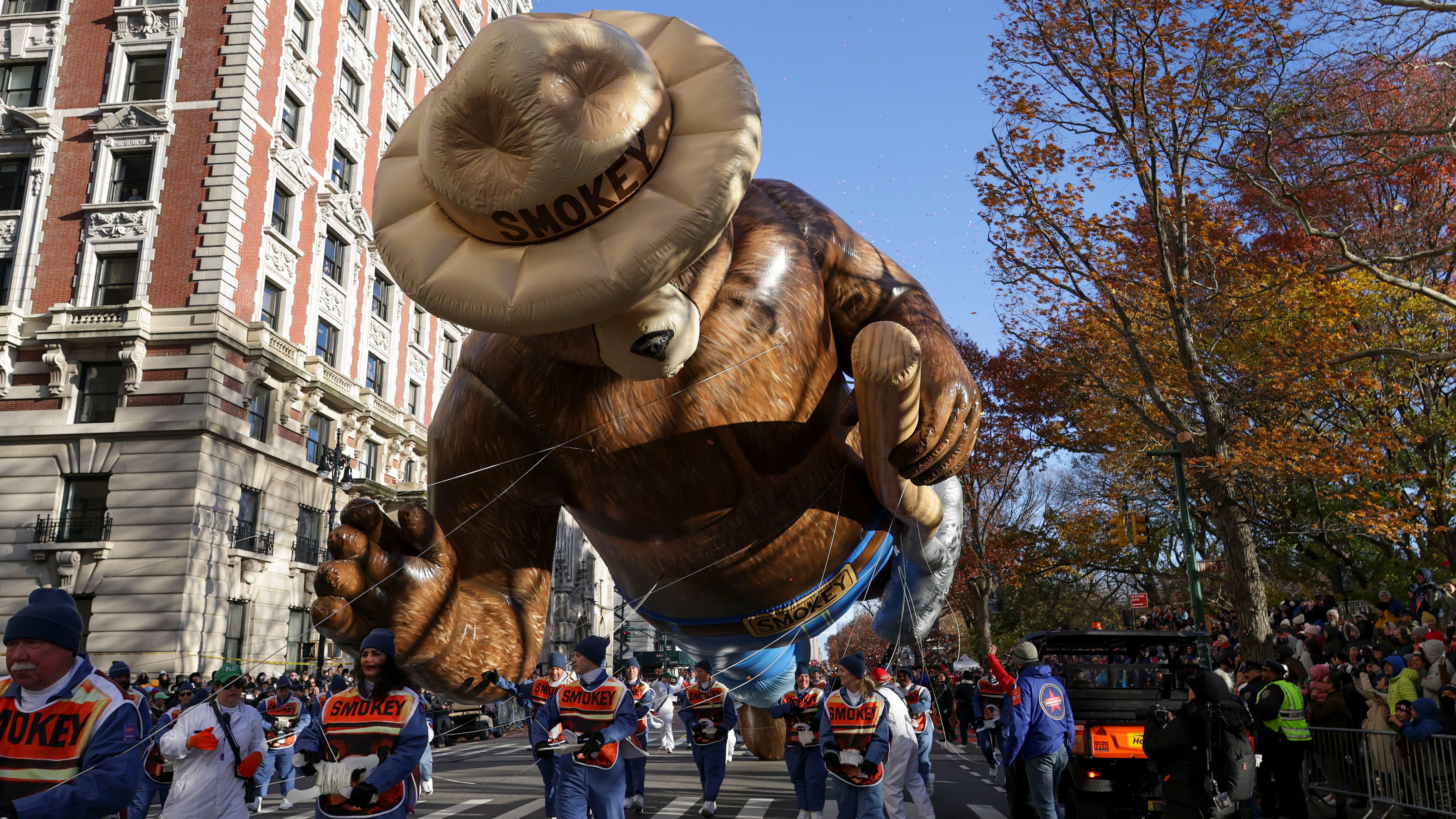 Handlers guide the Smokey Bear balloon along Central Park West during the Macy's Thanksgiving Day parade, Thursday, Nov. 23, 2023, in New York. (AP Photo/Jeenah Moon)