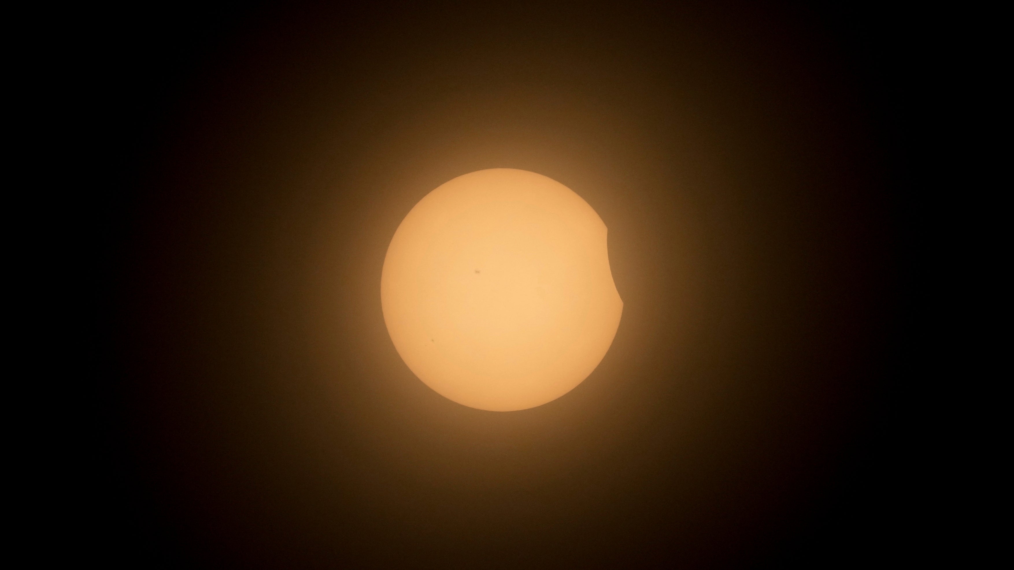The moon partially covers the sun during a total solar eclipse in Mazatlan, Mexico, Monday, April 8, 2024. (AP Photo/Fernando Llano)