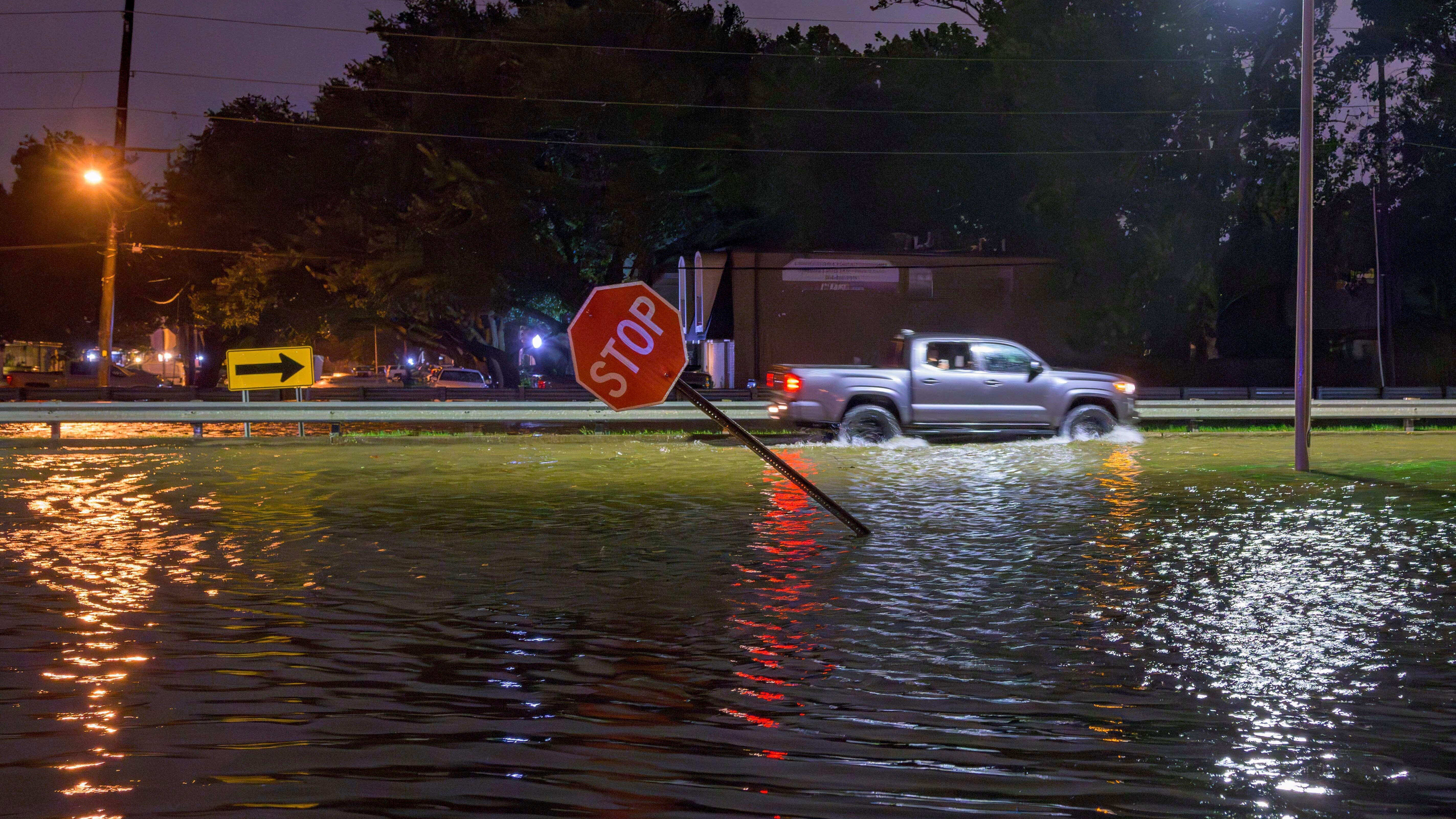 Water overflows the W. Napoleon Ave drainage canal into Neyrey Dr. after a deluge of rain from Hurricane Francine in Metairie, La., in Jefferson Parish, Wednesday, Sept. 11, 2024. Multiple drainage canals in Metairie were overtopped and overflowed into streets and neighborhoods according to Scott Walker, Council At-Large for Jefferson Parish. (AP Photo/Matthew Hinton)