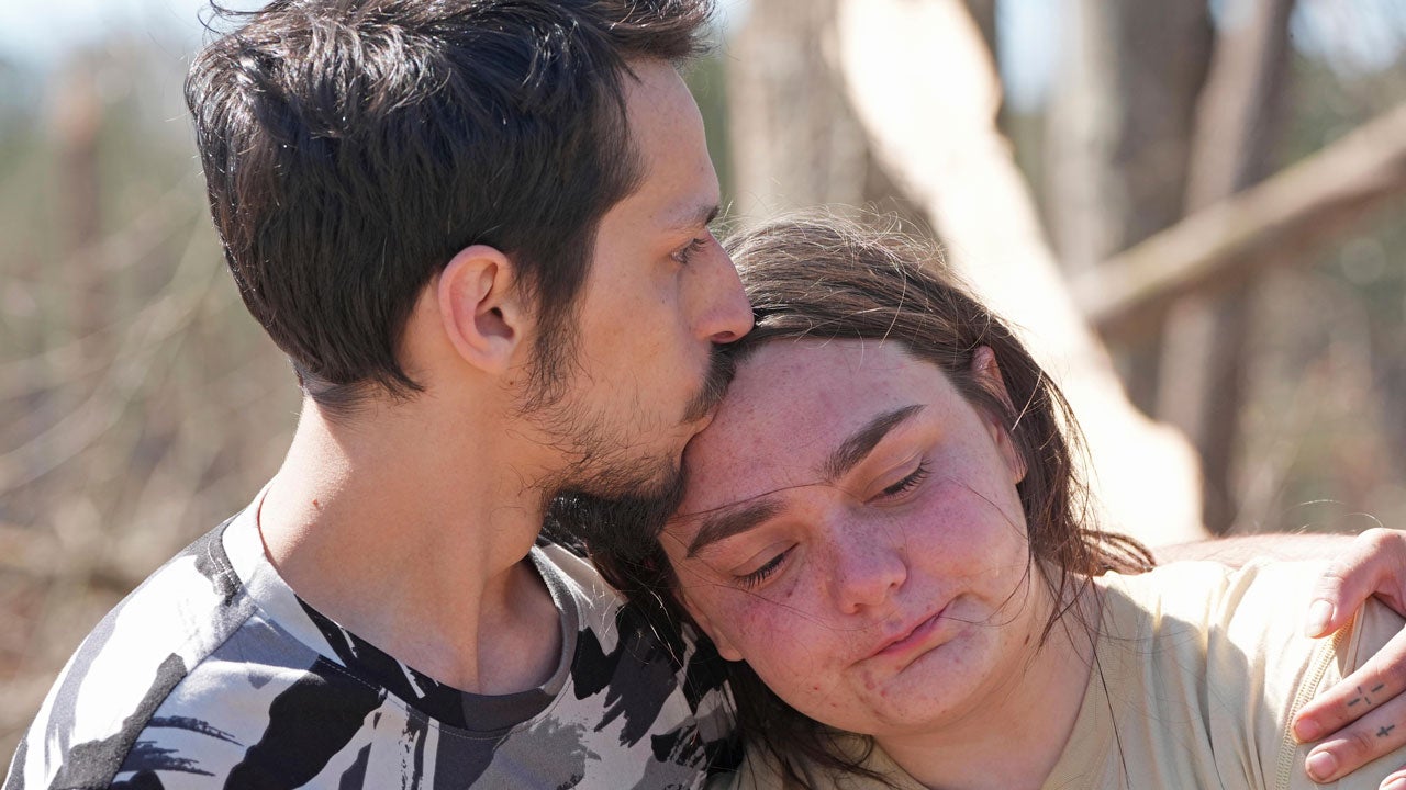 Steve Romero, comforts his fiancee, Hailey Hart, right, Sunday, March 16, 2024, after recalling how the couple and their three dogs rode out an apparent tornado in their small automobile, Saturday afternoon, in Tylertown, Mississippi. (AP Photo/Rogelio V. Solis)