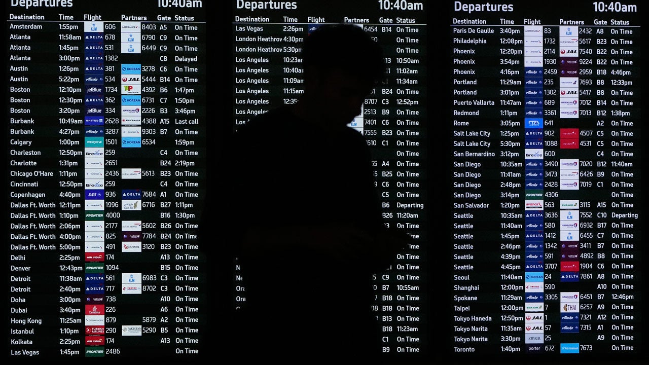 A traveler using TSA Pre-Check waits in a security line at a San Francisco International Airport terminal in San Francisco, Thursday, Nov. 6, 2025. (AP Photo/Jeff Chiu)