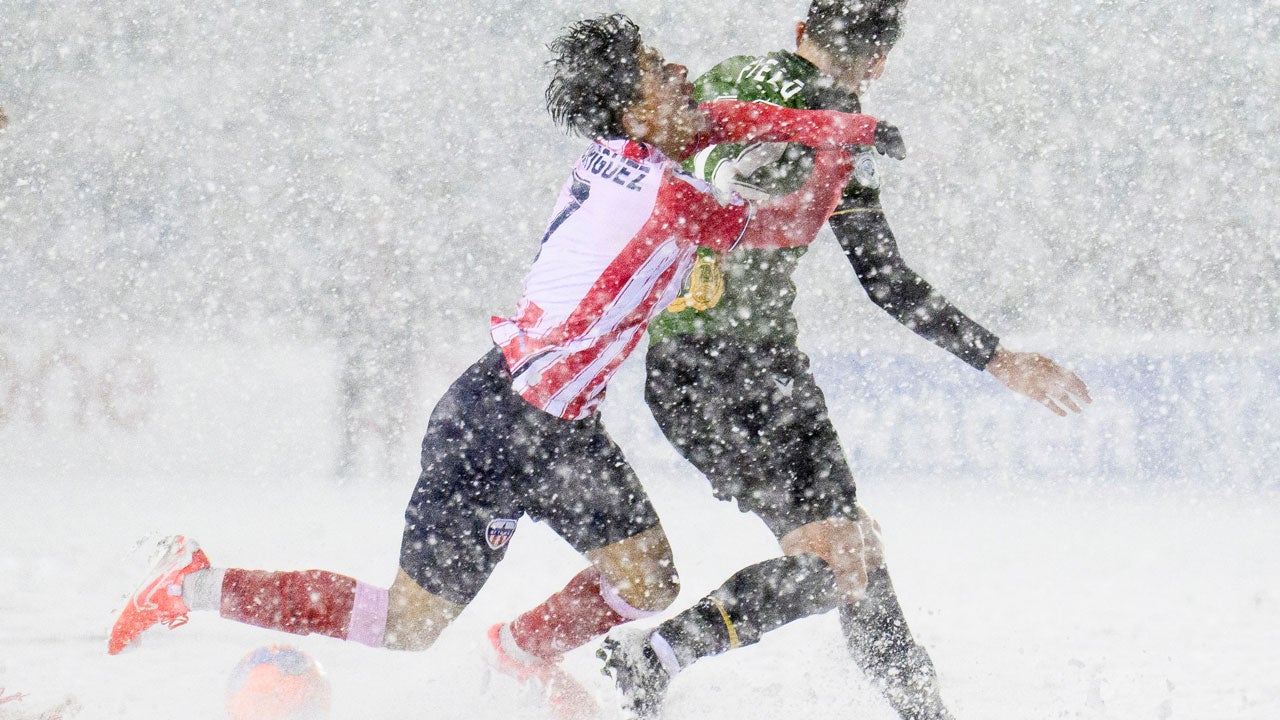 Atletico Ottawa's David Rodr&iacute;guez, left, loses his footing as he crashes into Atletico Ottawa's Monty Patterson, right, during second-half Canadian Premier League finals soccer match action in Ottawa, Ontario, Sunday, Nov. 9, 2025. (Spencer Colby/The Canadian Press via AP)