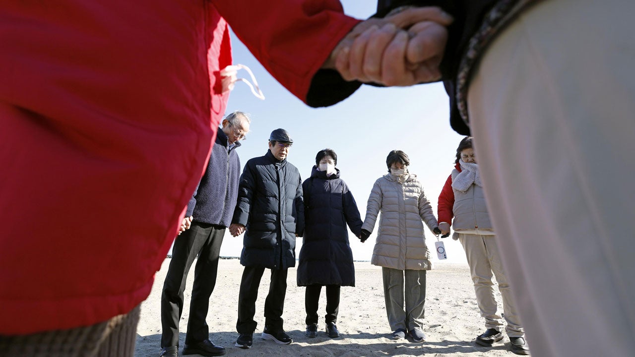 Prayers join their hands in Sendai, Miyagi prefecture, northern Japan, on Wednesday, March 11, 2026, as the country marked the 15th anniversary of the massive earthquake, tsunami and nuclear disaster. (Natsumi Yasumoto/Kyodo News via AP)