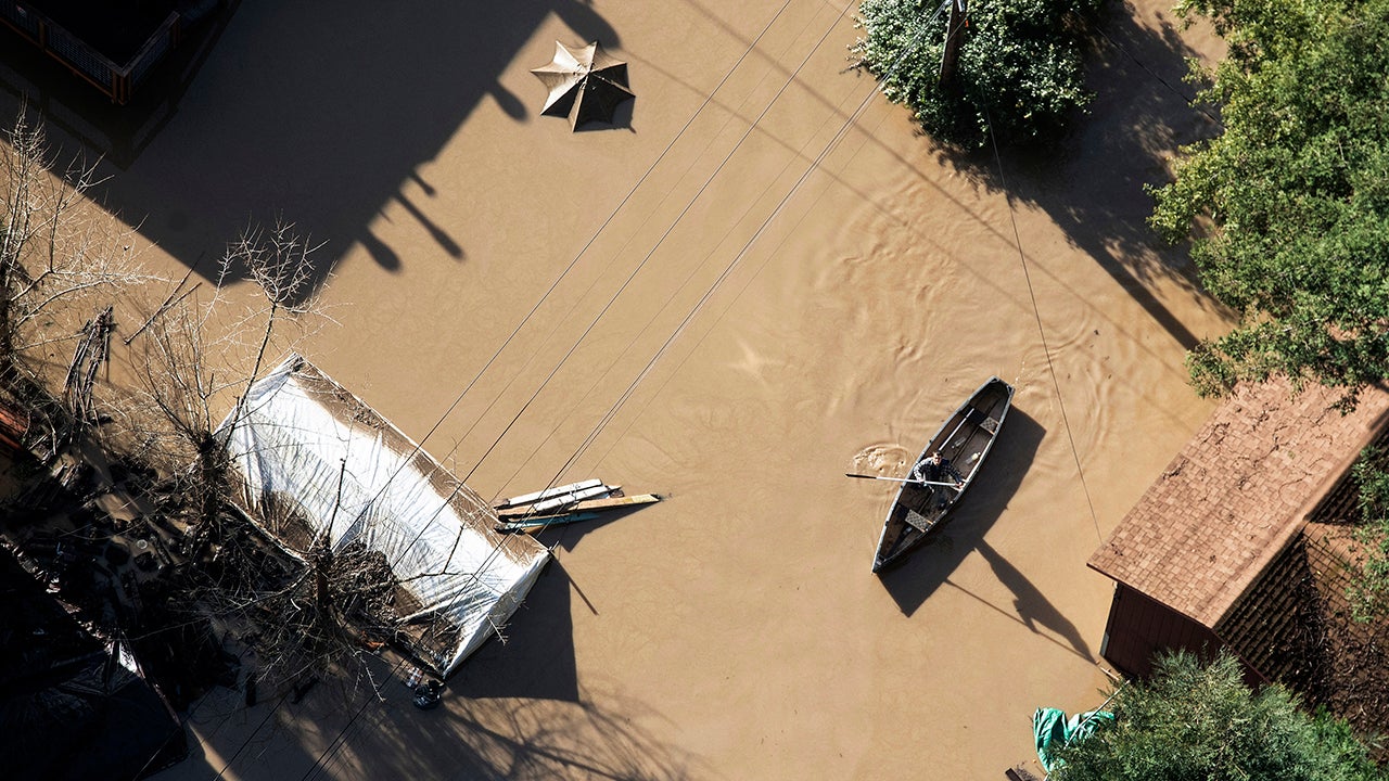 Flood waters from the Russian River partially submerge properties in Guerneville, Calif., on Thursday, Feb. 28, 2019.  The river in the wine country north of San Francisco reached its highest level in 25 years Wednesday night and Sonoma County officials say it won't return to its banks until late Thursday.   (AP Photo/Josh Edelson)
