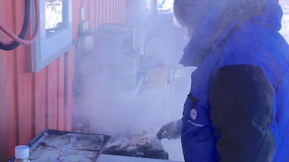 Grilling food at the Paleo site in Antarctica