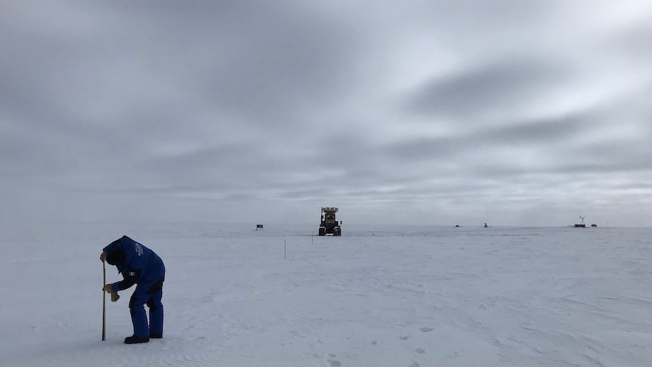 Vincent Favier measured heights of a wooden stake installed above the snow surface at AGO5 in Antarctica