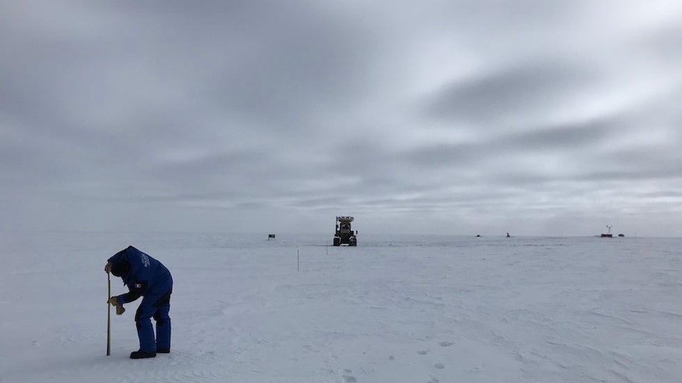 Vincent Favier measured heights of a wooden stake installed above the snow surface at AGO5 in Antarctica