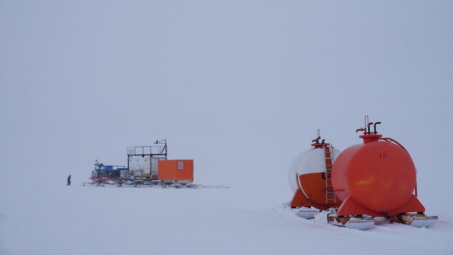 EIAAST caravan stops to check a seismic sensor under thick cloud cover