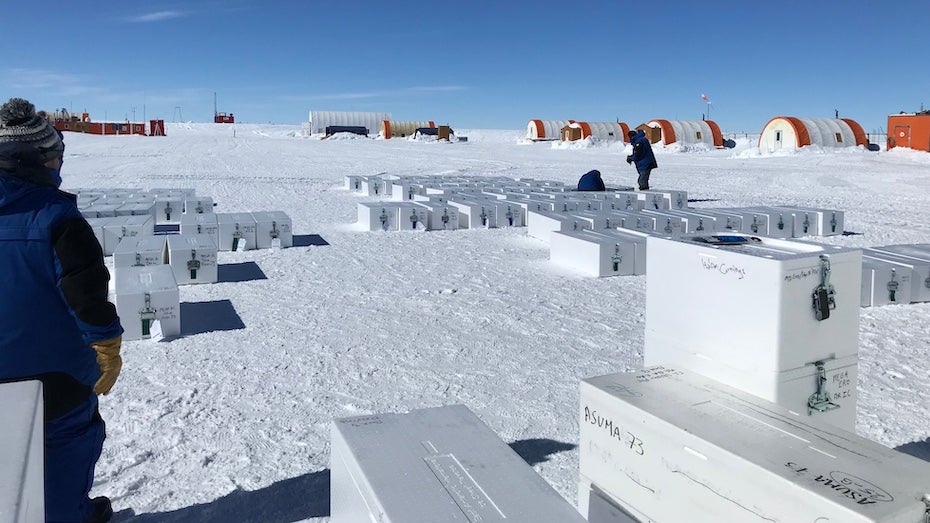 Boxes of snow and ice cores taken during EAIIST are sorted in the parking area of Concordia Station