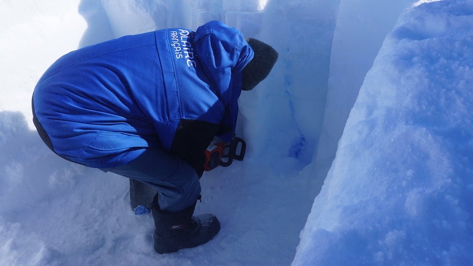An EAIIST team member excavates a pit along a thermal crack