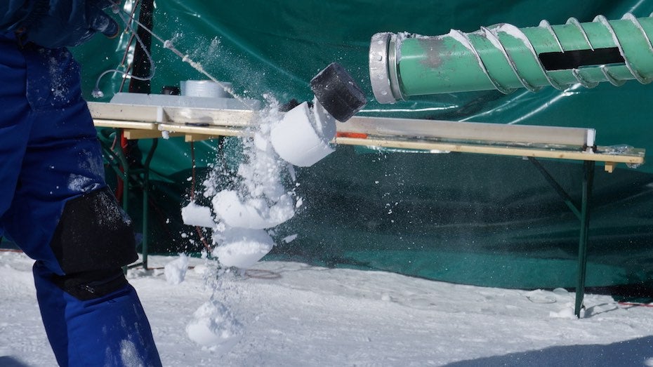 The plastic plug on top of the ice core is pulled out of the drill bit