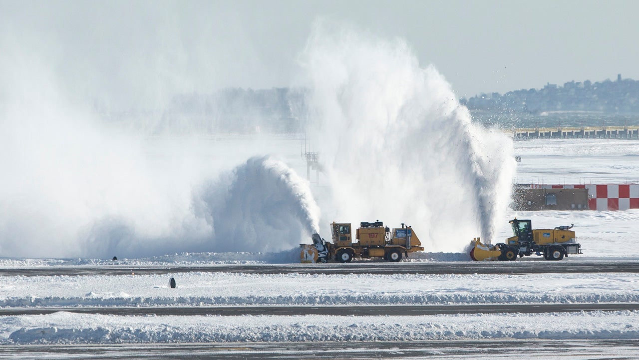 BOSTON, MA - JANUARY 05:  Snow removal equipment operators work the taxiway and runways at Logan International Airport following a "bomb cyclone" the previous day on January 5, 2018 in Boston, Massachusetts.  Schools and businesses throughout the Boston area get back to work today after the city received over a foot of snow during the fast moving storm yesterday. (Photo by Scott Eisen/Getty Images)