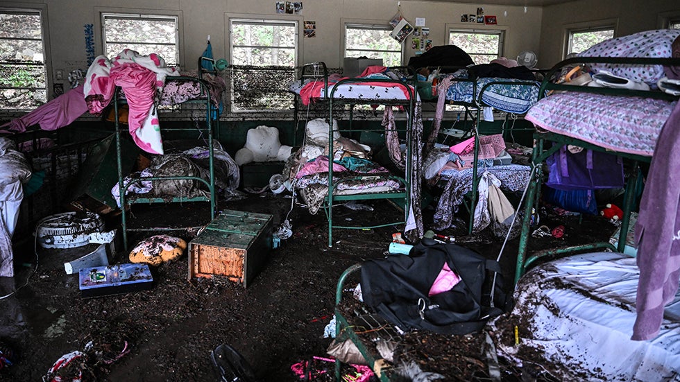 A view inside a cabin at Camp Mystic, the site where more than two dozen girls were missing after flash flooding in Hunt, Texas, on Friday, July 4, 2025. (Photo by RONALDO SCHEMIDT/AFP via Getty Images)

