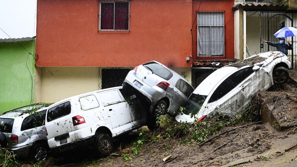 Cars damaged and swept during floods related by Tropical Storm Cristobal are pictured in Panchimalco, El Salvador, on 6/3/20