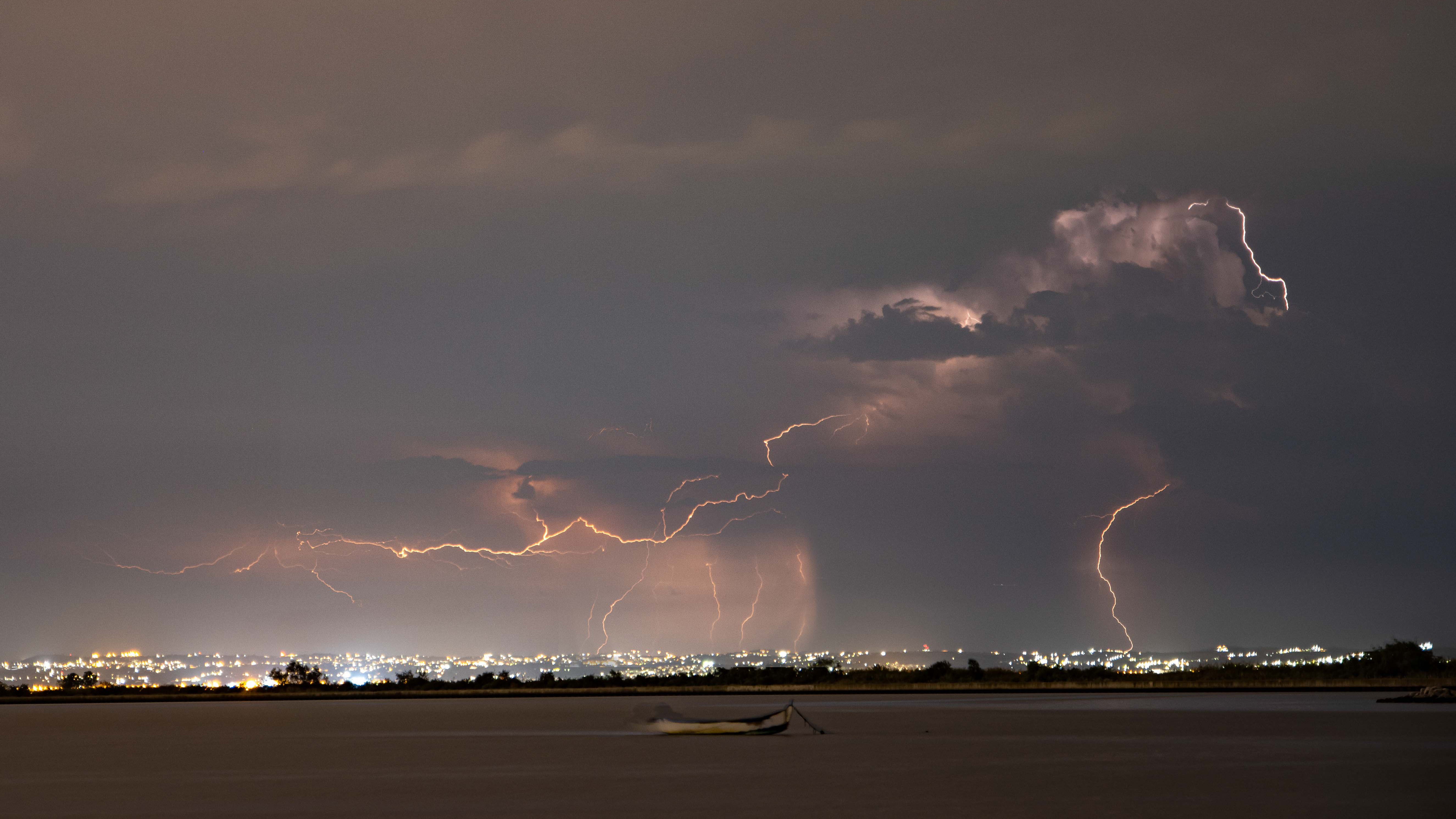 Lightnings during a summer night thunderstorm over Thessaloniki city and the sea as captured from Kalochori Lagoon in Northern Greece. The thunder storm with the lightning phenomenon is usually taking place during the summer and spring season.  On August 15, 2020 in Thessaloniki, Greece.  (Photo by Nicolas Economou/NurPhoto via Getty Images)
