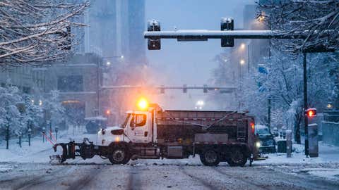 DENVER, CO - MARCH 14: A snow plow clears a road on March 14, 2021 in Denver, Colorado. More than 1800 flights into and out of Denver have been canceled this weekend and highways around the state have been closed down as a winter storm hits the state. (Photo by Michael Ciaglo/Getty Images)