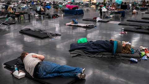 Portland residents fill a cooling center with a capacity of about 300 people at the Oregon Convention Center on June 27, 2021, in Portland, Ore. Record breaking temperatures lingered over the Northwest during a historic heatwave this weekend. (Nathan Howard/Getty Images)