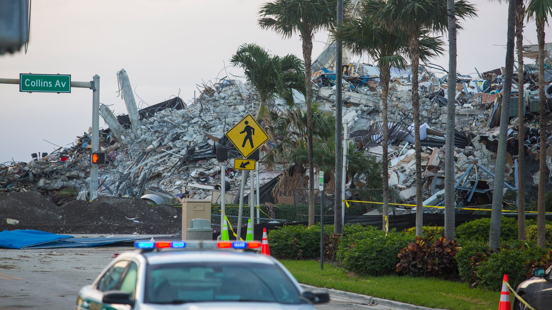 A pile of debris is seen the morning after the partially collapsed 12-story Champlain Towers South condo was taken down with a controlled demolition on July 5, 2021, in Surfside, Florida. The decision by officials to bring the rest of the building down was brought on by the approach of Tropical Storm Elsa and fears that the structure might come down in an uncontrolled fashion. Over one hundred people are missing as the search-and-rescue effort continues. (Saul Martinez/Getty Images)