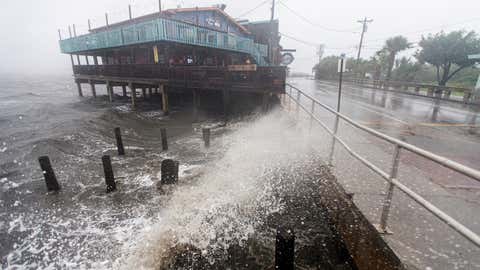 Tropical Storm Elsa creates large waves on July 7, 2021, in Cedar Key, Fla. A warning is in effect for a 200-mile stretch of Florida's gulf coastline as the storm makes landfall. After hitting Cuba on Monday, causing flooding and mudslides, Elsa is expected to pass over the states of Georgia and South Carolina in the coming days. (Mark Wallheiser/Getty Images)