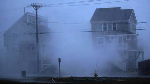 Waves crash over the seawall at Brant Rock in Marshfield, Mass., as a nor’easter hits the South Shore area on Oct. 27, 2021. (Craig F. Walker/The Boston Globe via Getty Images)