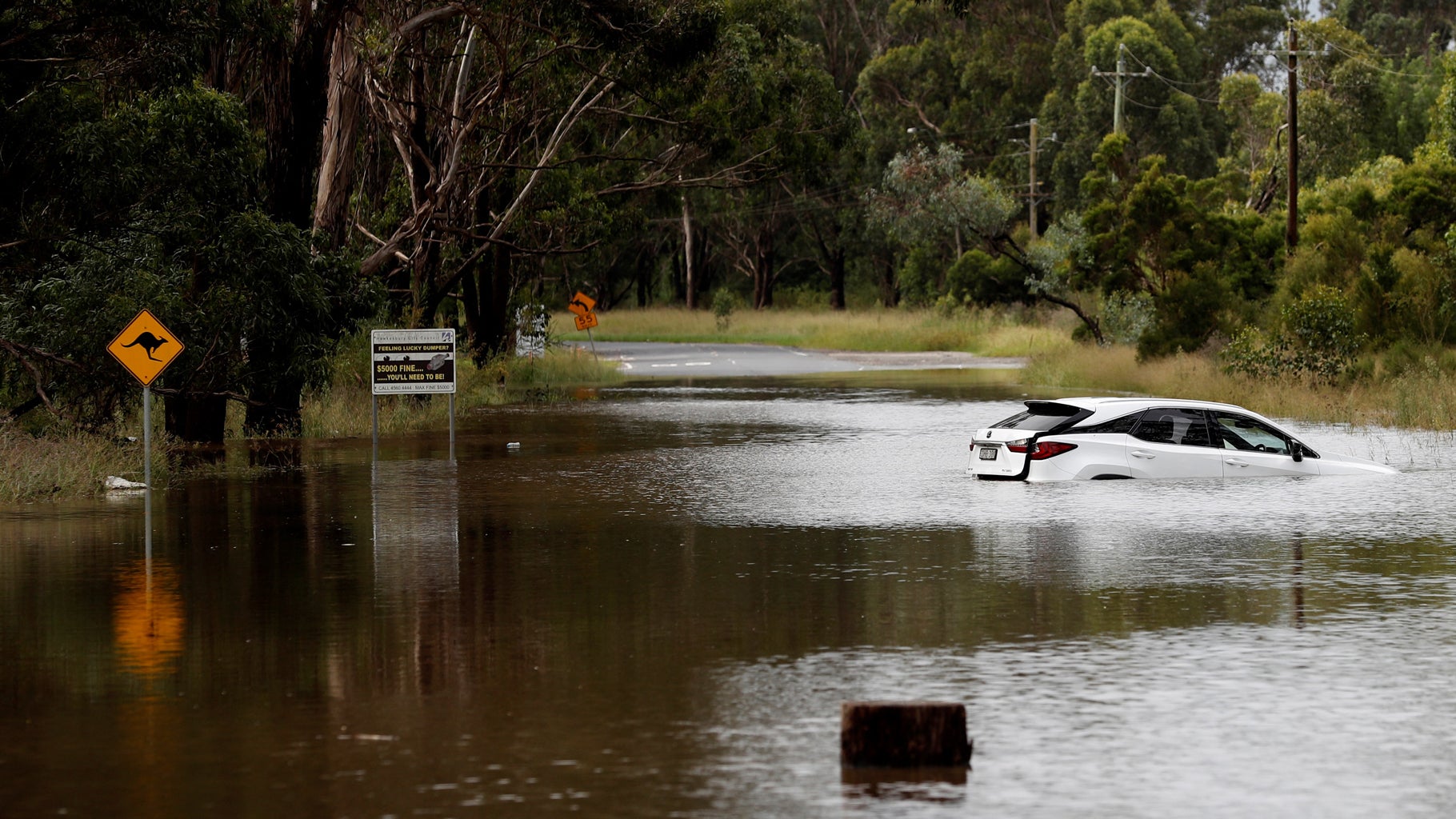 A car floats in floodwaters along the Hawkesbury River in suburban Sydney on Thursday, March 3, 2022. (Photo by NIKKI SHORT/AFP via Getty Images)