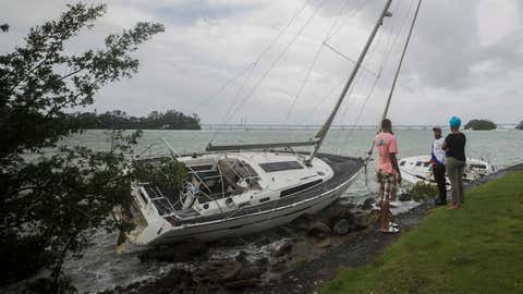A view of a sailboat being dragged to shore by strong waves in Samana Bay, after Hurricane Fiona hit, in Samana, Dominican Republic, September 20, 2022. - Hurricane Fiona dumped rain torrential storms over the Dominican Republic and one fatality, after triggering major flooding in Puerto Rico and widespread power outages in the two Caribbean islands. (Photo by Erika SANTELICES / AFP) (Photo by ERIKA SANTELICES/afp/AFP via Getty Images)