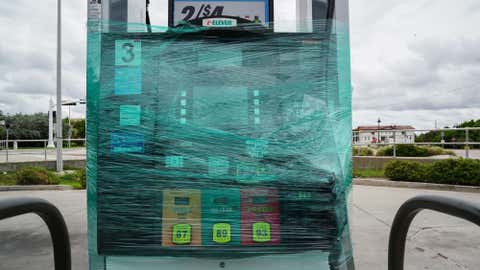 A gasoline pump is shut down and wraped in plastic in St. Pete Beach ahead of Hurricane Ian on September 27, 2022 in St. Petersburg. - The US National Hurricane Center (NHC) said Ian made landfall just southwest of the town of La Coloma, Cuba, at about 4:30 am local time (0830 GMT). The hurricane was packing maximum sustained winds of 125 miles (205 kilometers) per hour, the NHC said, making it a Category 3 storm on the Saffir-Simpson scale. (Photo by Bryan R. Smith / AFP) (Photo by BRYAN R. SMITH/AFP via Getty Images)