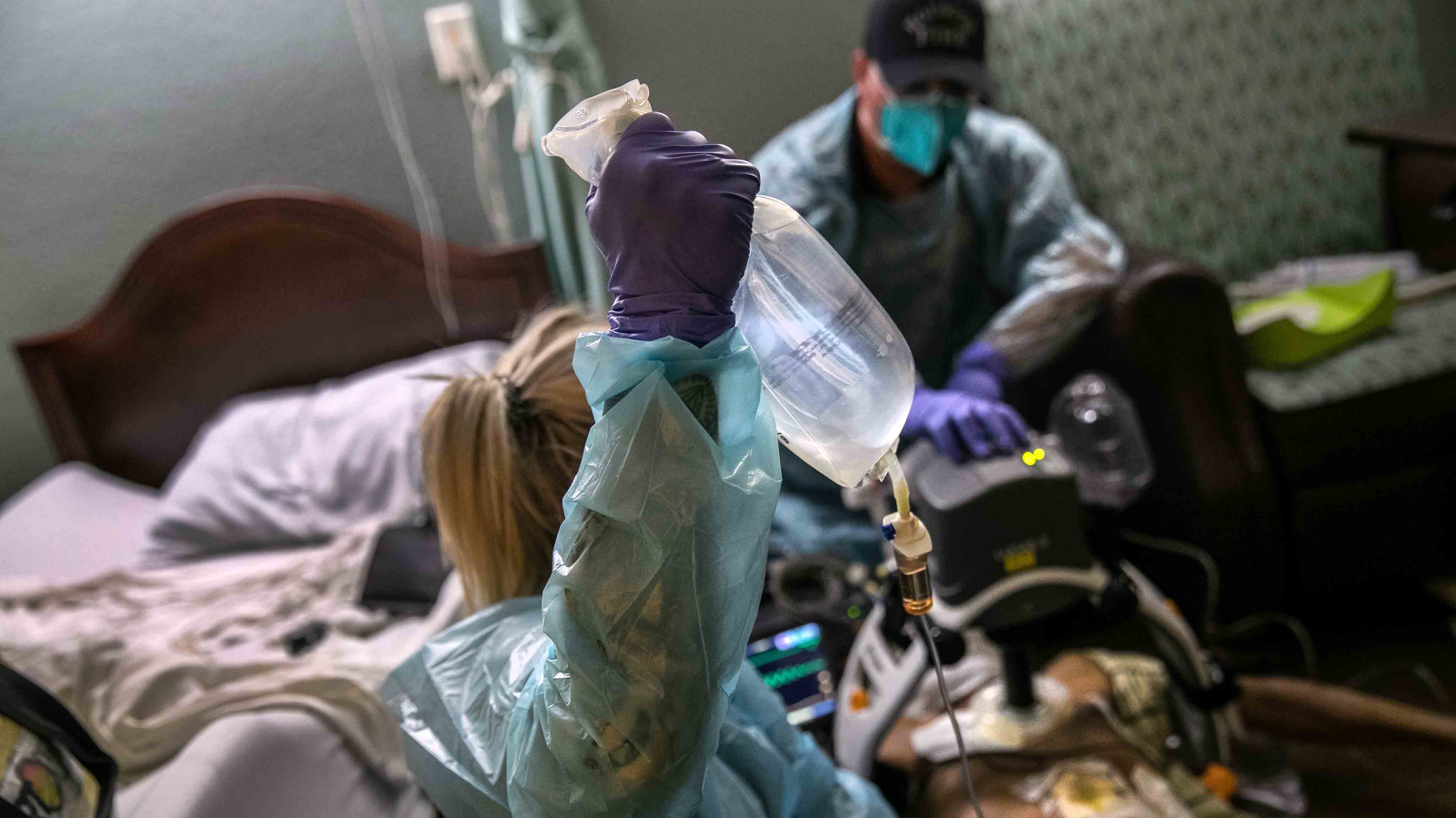 HOUSTON, TEXAS - AUGUST 12: (EDITORIAL USE ONLY) EMS medics from the Houston Fire Department try to save the life of a nursing home resident in cardiac arrest on August 12, 2020 in Houston, Texas. Heart failure, especially in seniors, is a common result of COVID-19 and medics treat most such cases as if they are COVID-positive. After extensive efforts, the man died. On Wednesday, the state of Texas reported its highest number coronavirus-related deaths yet. (Photo by John Moore/Getty Images)