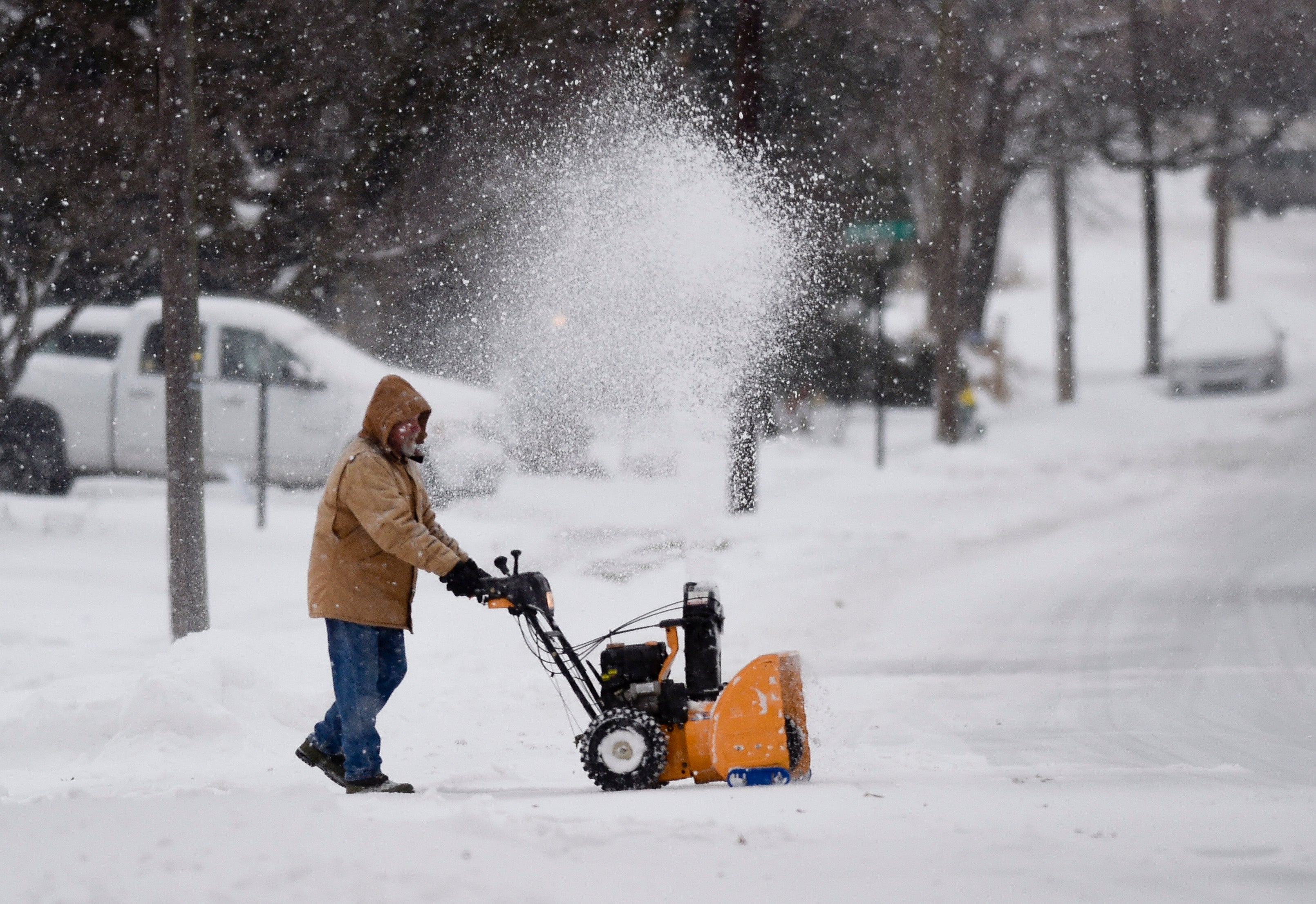 A man operates a snowblower on Sharp Ave in Muhlenberg Township, Pa., Monday, Feb. 1, 2021, during a nor’easter that hit the East Coast with heavy snow and winter weather. (Ben Hasty/MediaNews Group/Reading Eagle via Getty Images)