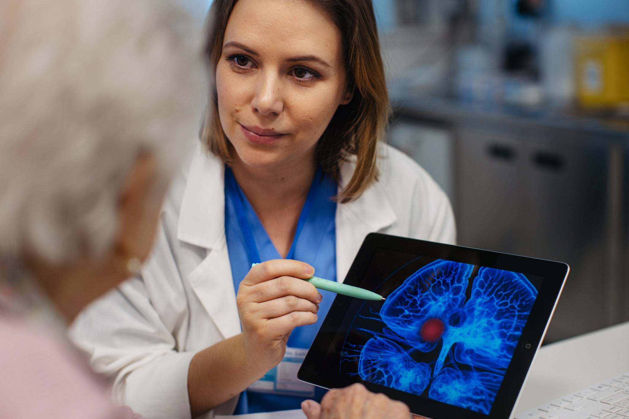 Doctor explaining results of MRI scan of brain to senior patient. Diagnosis of diseases for elderly people. Examination of brain, detecting stroke, dementia, head injures or neurological disorders.