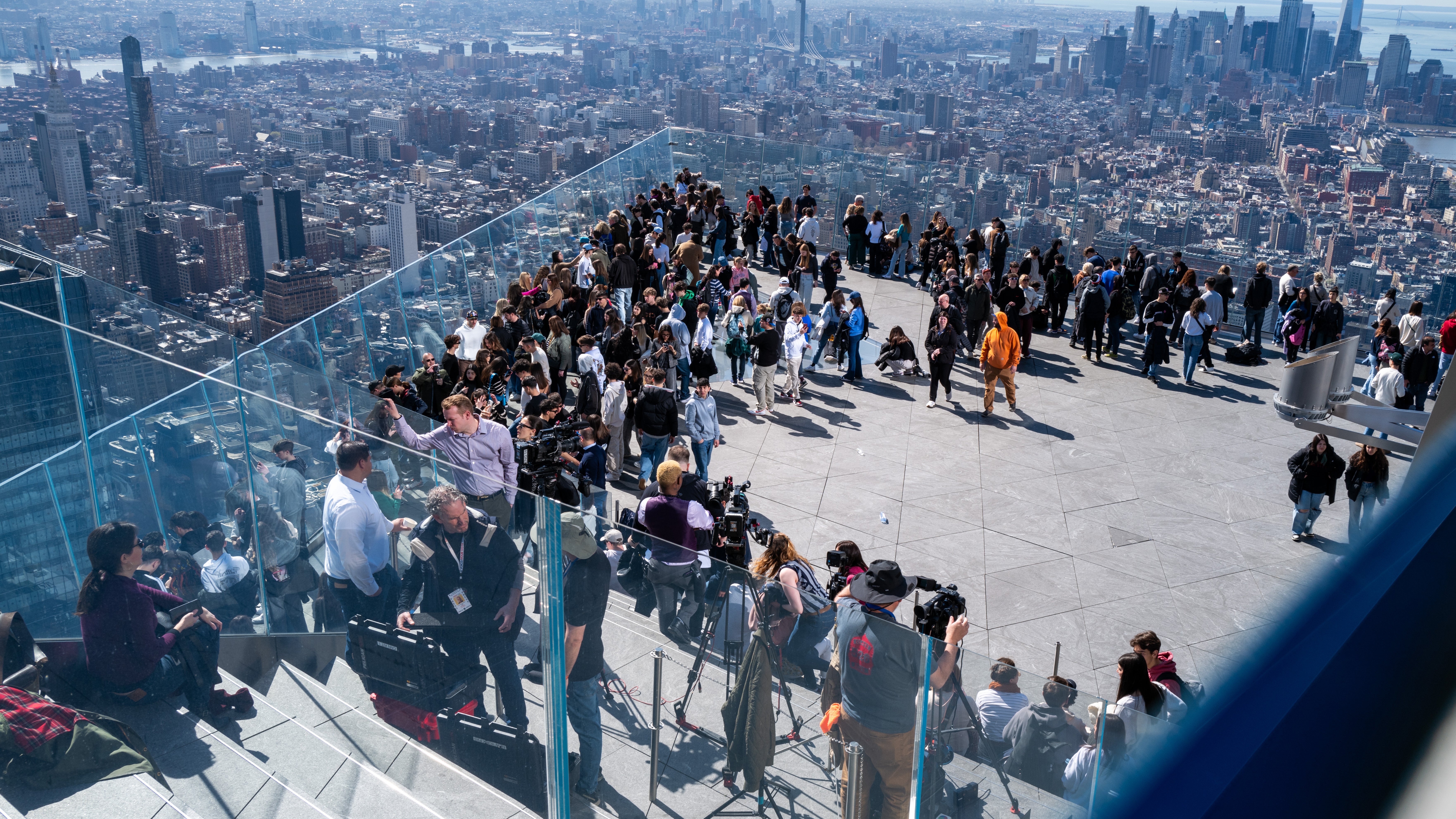 People gather on the observation deck of Edge at Hudson Yards before a partial solar eclipse on April 8, 2024, in New York City. (Photo by Spencer Platt/Getty Images)