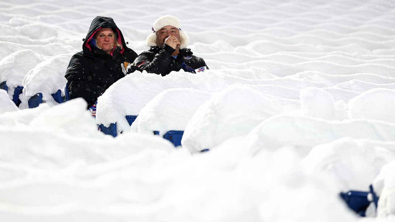 Fans sit in snow-covered seats prior to an NFL football game between the Buffalo Bills and the San Francisco 49ers at Highmark Stadium on Dec. 1, 2024, in Orchard Park, New York. (Photo by Kevin Sabitus/Getty Images)