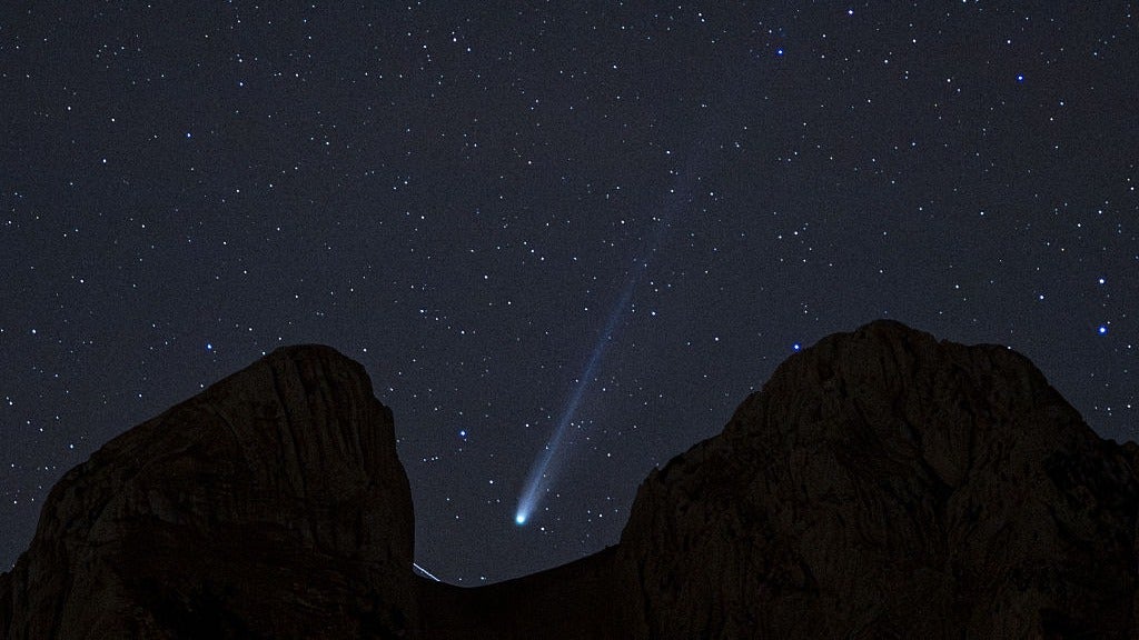 The comet C/2019 U6 (Lemmon), discovered on October 31, 2019, from the Mount Lemmon Observatory in Arizona, streaks across the night sky behind Pedraforca mountain in the Bergueda region in Spain on October 24, 2025. The comet, composed mainly of ice and dust, was named after the observatory where it was first detected, part of the Catalina Sky Survey program dedicated to tracking near-Earth objects. Pedraforca, located within the Cadi-Moixero Natural Park, is one of Spain's most iconic mountains, recognized for its distinctive double peak and symbolic importance to Catalan mountaineering. (Photo by Lorena Sopena/Anadolu via Getty Images)
