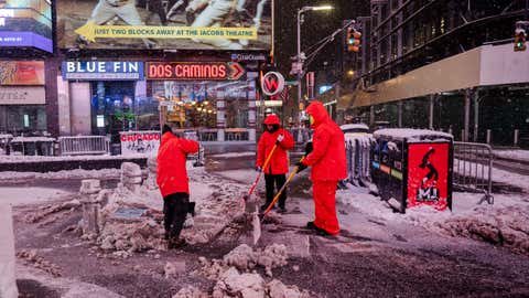 Workers shovel snow in the early-morning hours of Feb. 23, 2026, in Times Square. (Photo by Craig T Fruchtman/Getty Images)